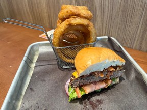 Onion rings and a half of a hamburger from Big Rig Kitchen & Brewery at the Ottawa International Airport