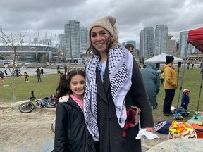 Seven-year-old Yafa Bishar with mother Sama Ghnaim at a Parents for Palestine rally in Vancouver on March 10.