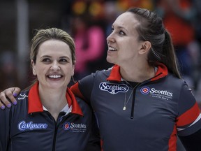 Team Ontario-Homan skip Rachel Homan, right, celebrates with vice-skip Tracy Fleury after defeating Team Manitoba-Jones in the final at the Scotties Tournament of Hearts in Calgary on February 25, 2024.