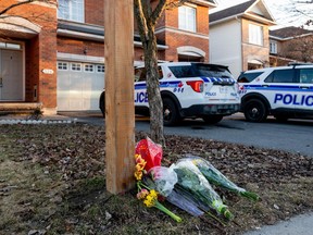OTTAWA, March 7, 2024: Flowers are seen outside the Barrhaven house where six people were killed. Spencer Colby/Postmedia