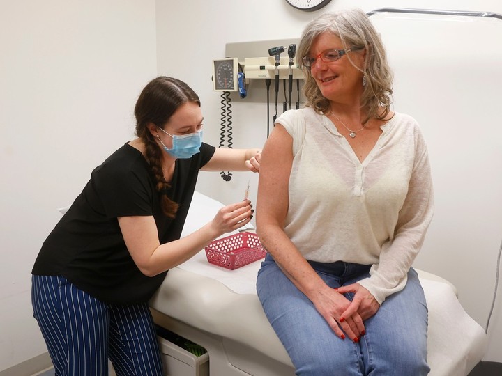  Nurse Kayla Fitzmaurice gives the measles vaccine to Julia Huckle at the Centretown Community Health Centre in Ottawa Friday, Mar. 15, 2024.