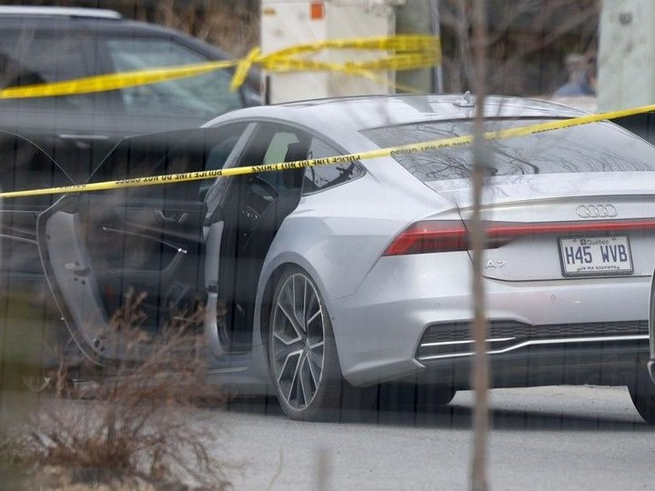  An Audi A7 with all its doors open at the scene of the shooting on Avondale Avenue.