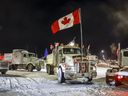 Anti-COVID-19 vaccine mandate demonstrators gather as a truck convoy blocks the highway at the U.S. border crossing in Coutts, Alta., Tuesday, Feb. 1, 2022. An internal RCMP review of the force's response to