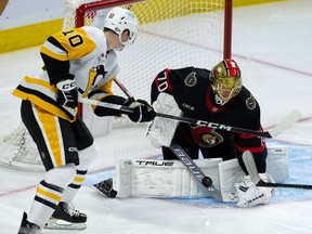 Ottawa Senators goaltender Joonas Korpisalo makes a save while under pressure from the Pittsburgh Penguins' Drew O'Connor during the second period on Tuesday night at the Canadian Tire Centre. Korpisalo's shutout bid came to an end with 22.6 seconds left in the third period.