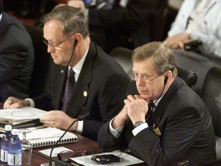  Then-Canadian prime minister Jean Chrétien (L) and then-Czech president Vaclav Havel listen to opening statements at the Euro-Atlantic Partnership meetings on the third day of the NATO Summit in April, 1999 in Washington, DC.