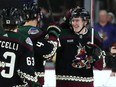 Arizona Coyotes' Josh Doan (right) smiles as he celebrates his two-goal NHL debut.