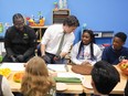 Prime Minister Justin Trudeau preparing food for a lunch program at the Boys and Girls Club East Scarborough