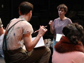 Theatre director Sarah Kitz gives instruction to actors during a rehearsal
