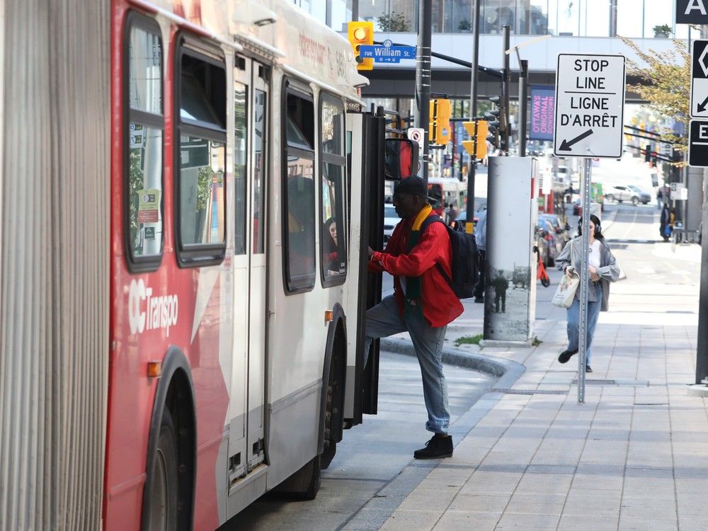 A passenger boards an OC Transpo bus downtown. Transit is a hot-ticket item when budget time rolls around.