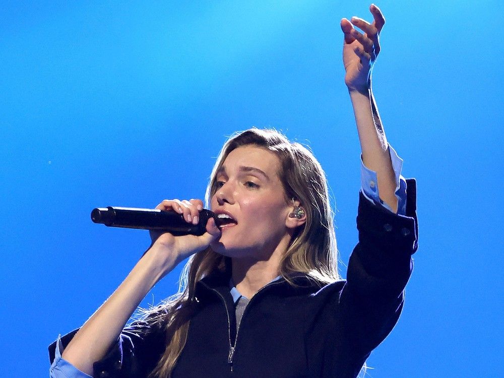 Charlotte Cardin sings at the microphone