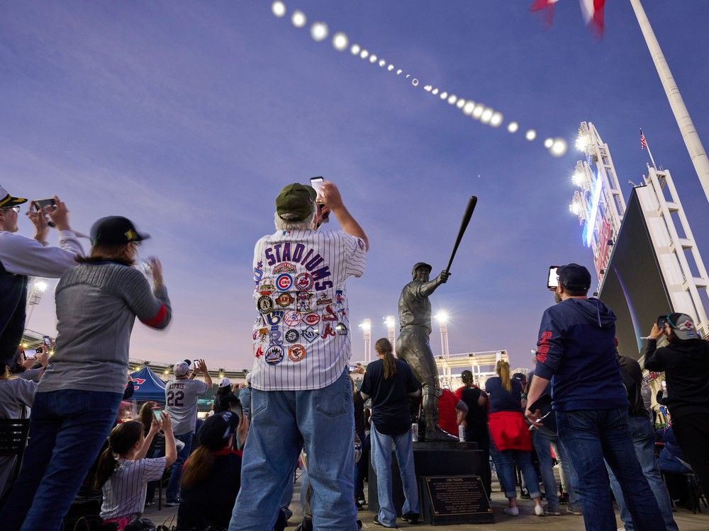  CLEVELAND, OHIO – APRIL 08: (EDITOR’S NOTE: Multiple exposures were used in the creation of this digital composite image) Fans watch the Great North American Eclipse over Progressive Field prior to a game between the Chicago White Sox and the Cleveland Guardians on April 08, 2024, in Cleveland, Ohio.
