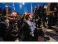 NEW YORK - APRIL 23: Jews and supporters participate in civil disobedience during a Passover Seder to protest the war in Gaza on April 23, 2024 in the in Brooklyn borough of New York City.