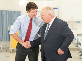 Prime Minister Justin Trudeau, left, and Ontario Premier Doug Ford attend an announcement at Seneca College, in King City, Ont., on Feb. 9.