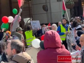 This acreenshot from a 44-second video was posted by Caryma Sa’d, a Toronto lawyer who regularly documents protests in the city. Sa’d wrote in a caption, “protesters react to breaking news of Iran launching drones at Israel in retaliatory attack for a strike which killed a top Iranian commander.”