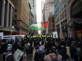 Protestors for Gaza gather outside a downtown hotel in Toronto the planned location of an event for Prime Minister Justin Trudeau, Friday, March 15, 2024. &ampnbsp;Pro-Palestinian groups are alleging Toronto officers are selectively policing at their organized protests after three males were arrested then released and three others were charged during a demonstration on Saturday.