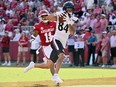 Cincinnati receiver Nick Mardner (84) makes a touchdown catch in front of Arkansas defensive back LaDarrius Bishop (11) during the second half of an NCAA college football game Saturday, Sept. 3, 2022, in Fayetteville, Ark.