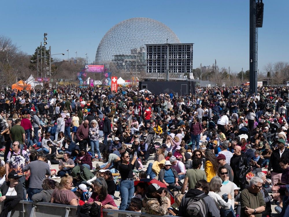  People gather to watch the total solar eclipse at Parc Jean Drapeau, in Montreal, Monday, April 8, 2024.