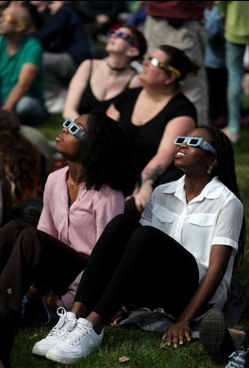  Sisters Womar Havor-Nutogo,17 and Elinam Havor-Nutogo, 19, seemed so excited to be witnessing history.Hundreds of people gathered at the Canadian Museum of Nature to watch the eclipse Monday afternoon.