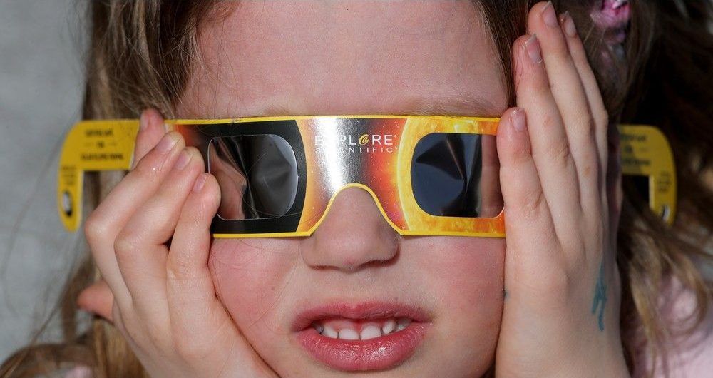  Young Athena Field, 4, made sure her special glasses were plastered to her head for the event. Hundreds of people gathered at the Canadian Museum of Nature to watch the eclipse Monday afternoon.