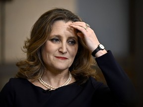 Deputy Prime Minister and Minister of Finance Chrystia Freeland waits for the start of a TV interview after tabling the federal budget on Parliament Hill in Ottawa, on April 16.
