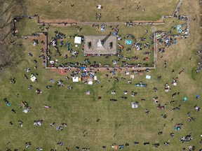 Families arrive at Crysler's Farm outside Cornwall Monday to prepare to get a look at the total eclipse.