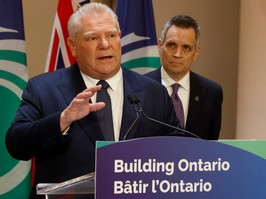 Ontario Premier Doug Ford is shown with Mayor Mark Sutcliffe