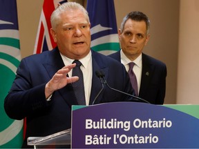 Ontario Premier Doug Ford is shown with Mayor Mark Sutcliffe