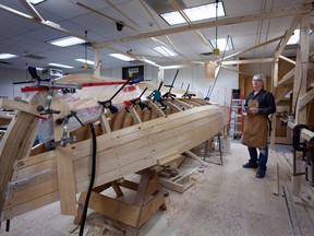 Student Derrick Cove with a traditional Newfoundland punt that he is learning how to build during the Winter semester at Memorial University of Newfoundland, in St. John's, Tuesday, March 26, 2024.