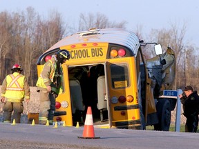 Three children and the driver of a school bus were taken to hospital with injuries Monday after the bus collided with a truck along Route 400 in Russell Monday afternoon.