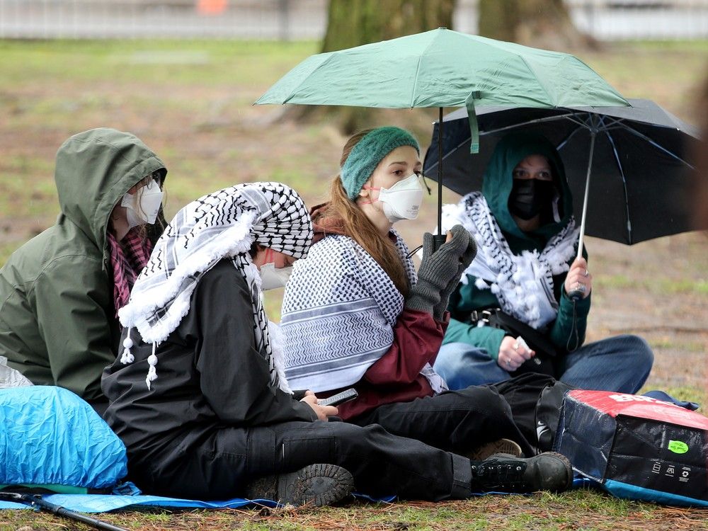 A gathering of about 20 protesters were set up outside Tabaret Hall at the University of Ottawa.
