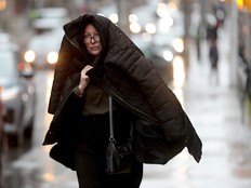 People were using coats, umbrellas or whatever they had to avoid the wet mix of rain and sleet in advance of the snowstorm expected Wednesday evening in downtown Ottawa.