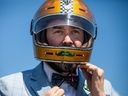 Rob Taylor, one of the organizers of the Ottawa Distinguished Gentleman's Ride put on his helmet before hitting the road Sunday.