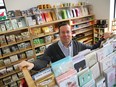 Sean Everett stands in the middle of his store, The Papery