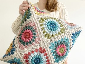 This crocheted pillow complements the time-honoured textiles trend.