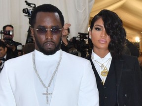 FILE: Sean Combs (L) and singer Cassie Ventura arrives for the 2018 Met Gala on May 7, 2018, at the Metropolitan Museum of Art in New York.