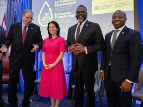 U.S Ambassador to Canada David Cohen, left to right, Montreal Mayor Valérie Plante, Chicago Mayor Brandon Johnson and Milwaukee Mayor Cavalier Johnson arrive for a plenary session at the Great Lakes and St. Lawrence Cities Initiative annual conference Wednesday, May 15, 2024 in Montreal.