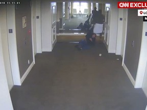 This frame grab taken from hotel security camera video and aired by CNN appears to show Sean "Diddy" Combs attacking singer Cassie in a Los Angeles hotel hallway in March 2016. (Hotel Security Camera Video/CNN via AP)