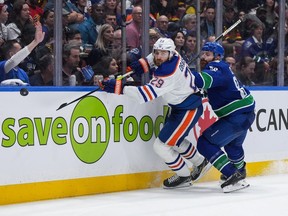 The Oilers have been here before, heading back to Edmonton with their season on the line. The team is looking for a different result this time around. Edmonton Oilers' Leon Draisaitl, left, and Vancouver Canucks' Ian Cole vie for the puck during the second period in Game 5 of an NHL hockey Stanley Cup second-round playoff series, in Vancouver, B.C., Thursday, May 16, 2024.