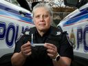 Acting Sgt. Amy Gagnon holds drug screening equipment Ottawa police use to test for cannabis and cocaine use. Gagnon works with the police service's Impaired Driving Countermeasures Unit.