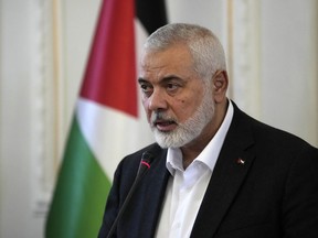 Hamas chief Ismail Haniyeh speaks during a press briefing after his meeting with Iranian Foreign Minister Hossein Amirabdollahian in Tehran, Iran, Tuesday, March 26, 2024. The chief prosecutor of the International Criminal Court said Monday he is seeking arrest warrants for Israeli and Hamas leaders, including Israeli Prime Minister Benjamin Netanyahu, in connection with their actions during the seven-month war between Israel and Hamas. Haniyeh is one of the three Hamas leaders believed to be responsible for war crimes and crimes against humanity in the Gaza Strip and Israel.