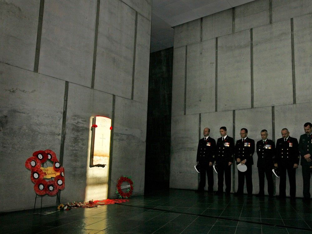  Chief Warrant Officers and Chief Petty Officers of the Canadian Forces observe Remembrance Day silence in the Memorial Hall of the Canadian War Museum, where a beam of light from the sun shines directly on the headstone of the Unknown Soldier at exactly 11 a.m.  David Kawai, Postmedia