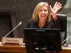 Diane Deans waves at committee meeting