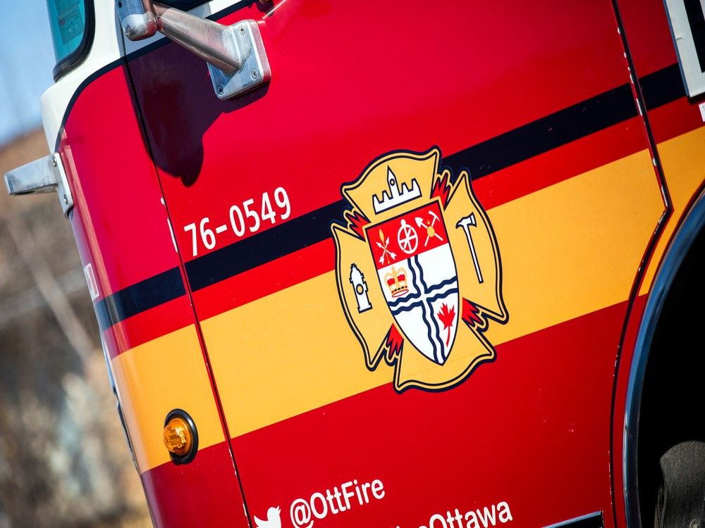 Ottawa firefighters extricate driver from vehicle upside down in a field