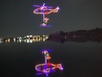 Multi-coloured drones form a helicopter patter over Dow's Lake