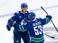 Vancouver Canucks' Nikita Zadorov celebrates his goal against the Edmonton Oilers with Teddy Blueger during the third period in Game 1 of an NHL hockey Stanley Cup second-round playoff series, in Vancouver, on Wednesday, May 8, 2024.