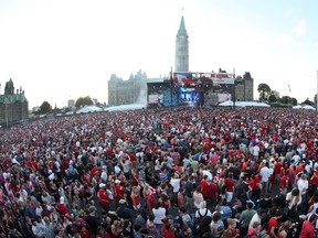 A massive crowd on Parliament Hill takes in the evening show, during Canada Day celebrations, July 01, 2012.