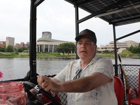 Bruce Deachman operating a water taxi.