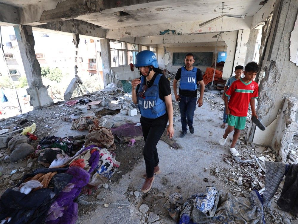 Members of a United Nations investigation team visit a school run by the UN Relief and Works Agency for Palestine Refugees (UNRWA) which was hit during an Israeli strike this week.