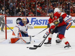 SUNRISE, FLORIDA - JUNE 24: Sam Reinhart #13 of the Florida Panthers shoots against Stuart Skinner #74 of the Edmonton Oilers during the third period of Game Seven of the 2024 Stanley Cup Final at Amerant Bank Arena on June 24, 2024 in Sunrise, Florida.