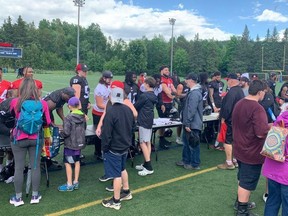 Fans line up for Redblacks autographs following Saturday’s open practice at Mont Bleu Stadium in Gatineau. Don Brennan/Postmedia